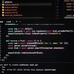 Developer writing code for a custom web application on a laptop